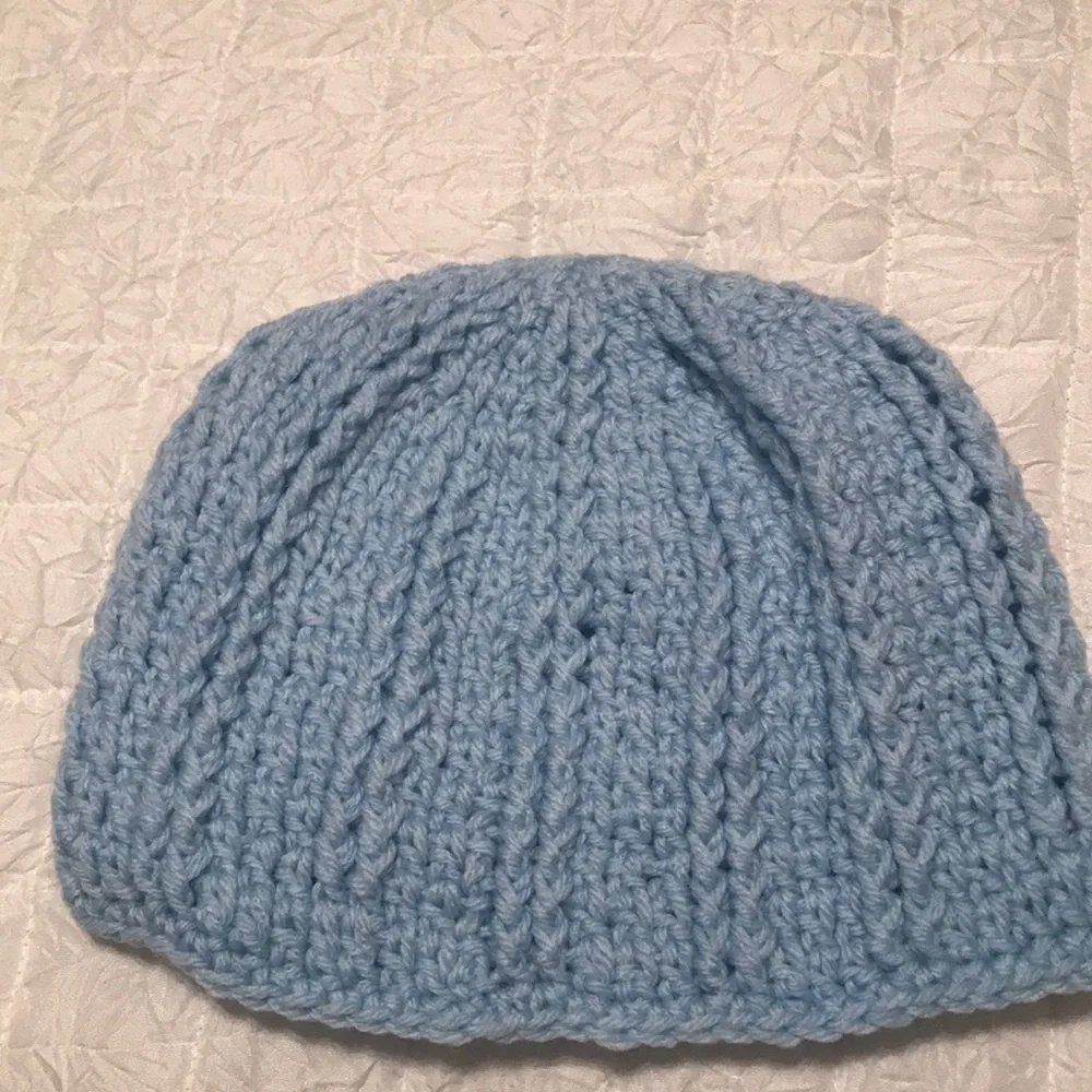 Handmade Crochet hat. Never worn. Baby Blue in color. I have three made.